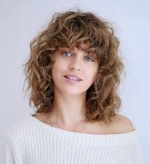 As you can see, this style works better than the previous one to counter the roundness of her curtain bangs: 50 Most Trendy And Flattering Bangs For Round Faces In 2021 Hadviser