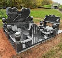A bespoke double heart memorial with a beautiful hand carved ...