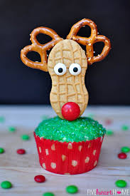 These nutter butter reindeer are a fun and easy christmas treat. Christmas Cupcake Toppers Using Nutter Butters Fivehearthome