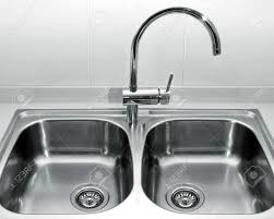 Offering added flexibility for your kitchen design ideas, this versatile sink can be mounted. A Double Bowl Stainless Steel Kitchen Sink On A White Granite Worktop Stock Photo Picture And Royalty Free Image Image 22302388