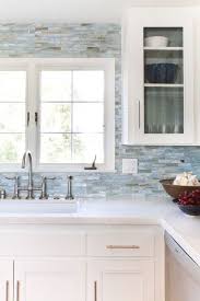 White Cabinets Small Blue Tiles All Over And White Quartz Countertops Kitchen Inspiration Design Beach House Kitchens White Kitchen Design