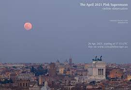 A pink supermoon sets behind the statue of liberty in new york city, new york photograph: The 2021 Pink Supermoon Online Observation 26 April 2021 The Virtual Telescope Project 2 0