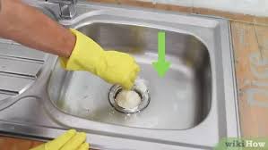 The gurgling in your kitchen sink drain trap is because your drain system from you upstairs toilet is not vented properly. 3 Ways To Unclog A Kitchen Sink Wikihow