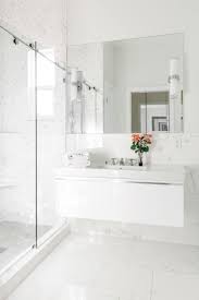 A white marble top completes the look of this modern bathroom vanity. Modern High Gloss White Marble Bathroom White Marble Bathrooms White Bathroom Designs Marble Bathroom
