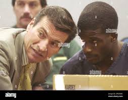 Karland Bennett, right, one of the four former Brigham Young University  football players accused of rape, talks with his attorney, Greg Skordas  before a bail hearing in Provo, Utah, Tuesday, Dec. 14,