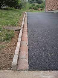 While it may seem like an inconsequential implement, driveway edging can lift an entire home's exterior aesthetic to a whole new level. Decorative Edging With Pavers Landscape Edging Garden Pavers Backyard Landscaping Designs