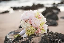 The brides hair and makeup was natural and hair was styled with beach waves. 100 Beach Wedding Bouquets Tropical To Boho Inspiration