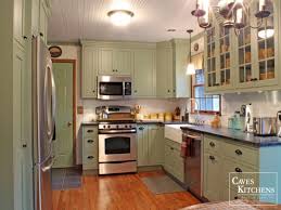 Sage green chalk painted cabinet with wood floor for traditional. Home Living Blog Green Kitchen With Black Appliances