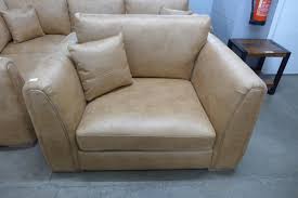 An Austin milan tan faux leather snuggle chair RRP £599.99