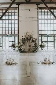 Ghost Chairs Gorgeous Florals And The Perfect Industrial Venue All Came Beautiful Wedding Decorations Industrial Wedding Venues Industrial Wedding Inspiration