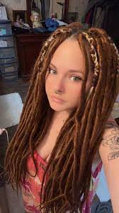 How does one put dreadlocks up in a bun or a ponytail without it being  about half a foot in the air 😂😂 any tricks please!