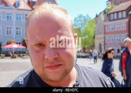 overweight young man with blond Hair Portrait Stock Photo