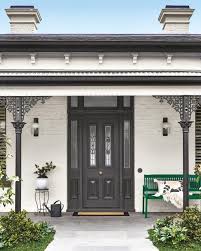 Black And White House Exterior Australia Pair A Black And White Exterior Scheme With A Pop Of Dulux Green Paw Paw For A Bold Entrance Window And Trim House Exterior House Paint Exterior Facade House