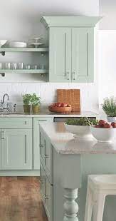 A beige mosaic tile backsplash brings depth to this large kitchen and is an elegant pairing with the room's pale green cabinetry. 51 Kitchen Design Ideas Which Will Leave You Green With Envy Love The Classic Shaker C Beautiful Kitchen Cabinets Green Kitchen Designs Green Kitchen Cabinets