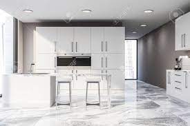 The flooring is wide plank, random length white oak with a custom stain. Interior Of Modern Kitchen With Beige Walls Marble Floor White Stock Photo Picture And Royalty Free Image Image 117068582