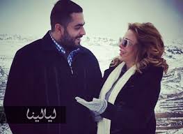 صور سوزان نجم الدين مع أخيها المنتصر وحب يتحدى الثلوج Lab Coat Fashion Jackets