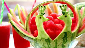 What do you carve into a pumpkin? Art In Watermelon Peacock Fruit Vegetable Carving Lessons Vegetable Carving Fruit And Vegetable Carving Food Garnishes