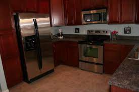 I can tell you i spent much more time cleaning the white than i do the stainless. Cherry Maple Wood Kitchen Cabinets
