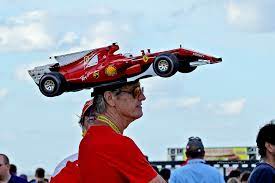 Maybe you would like to learn more about one of these? Since 2002 Avid Ferrari F1 Fan Kim Reimer From Tallahassee Florida Attends F1 Races In North America Wearing A Self Made Hat Resembling That Year S Ferrari F1 Car Expect Him To Show Up