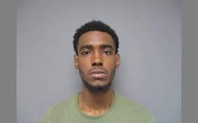 Man charged with breaking into cars, using stolen credit cards