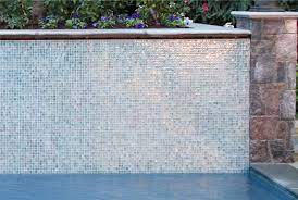 Check Out More Design And Flooring Ideas At Www Carolinawholesalefloors Com Or Our Facebook Page Iridescent Mo Pool Tile Pool Tile Designs Swimming Pool Tiles