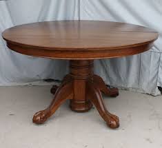 This table has four leaves with a straight apron and rests on round, baluster style legs with carved acanthus leaf ornamentation. Round Oak Dining Table Claw Feet 52 2 Leaves Bargain John S Antiques Oak Dining Table Round Oak Dining Table Dining Table