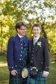 Regularly played at national rugby and football matches, flower of scotland evokes the country's very significant victory against england at the battle of bannockburn in 1314, led by robert the bruce. Groom And His Father In Traditional Scottish Kilts