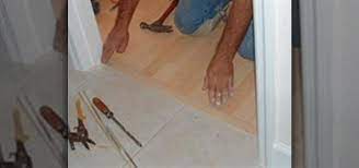 It's also durable and relatively inexpensive ensure that the ceramic tile floor is level and free of cracks. How To Install A T Mold Transition Between Laminate Ceramic Tile Construction Repair Wonderhowto