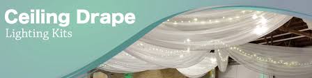 Ceiling draping really helped in the transformation of this warehouse space to a beautiful wedding ceremony setting. Wedding Ceiling Drapes With Lights Event Decor Direct