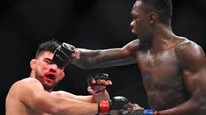 Israel adesanya for ufc 259 including michael chiesa, joanne calderwood, anthony smith, kelvin gastelum, jimmie rivera, rob font, lerone murphy, mike grundy, ma watch video >>. Fight Of The Year Israel Adesanya Claims Ufc Gold In Instant Classic With Kelvin Gastelum Rt Sport News