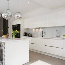 White and gray kitchen with white shaker cabinets paired with white quartz countertops and shiny white backsplash. High Gloss White Kitchen Houzz