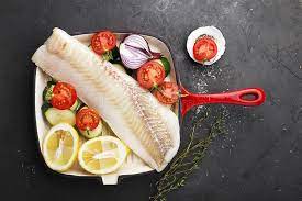 According to healthline, cooked zucchini is high in vitamin a, supporting the vision and the immune system. Cod Fresh Sea White Raw Fish Before Cooking In A Frying Pan With Fresh Vegetables Zucchini Sweet Onions Tomatoes And Stock Photo Image Of Healthy Dark 110399528