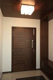 Foyer In The Entrance Gives A Warm Look In Wooden False Ceiling And Decorative Light Ceiling Design False Ceiling Door Design