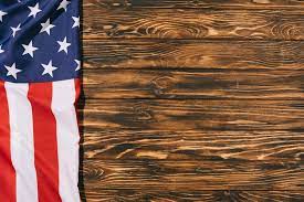 While nobody is certain who made the first official flag. Top View Of Folded American Flag On Wooden Tabletop Americas Independence Day Concept Free Stock Photo And Image