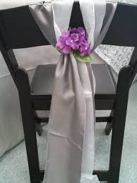 Satin Silver Organza Sashes Are Looking Lovely On This Black Folding Chair Chair Decorations Fold Up Chairs Wedding Chairs