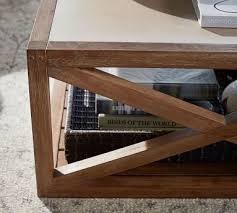 A reclaimed wood coffee table is inviting because it feels lived in. Grove Square Coffee Table Camden Pottery Barn Havenly