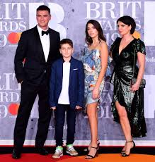 Born in london to albanian parents, dua came to love music through her father, himself a musician. Dua Lipa S Really Hot Dad Turns Heads At Brit Awards People Com