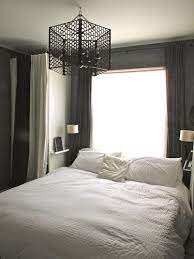 Shear curtains to let natural light in, a glass nightstand, and no headboard open up the bedroom. 27 Small Bedroom Ideas Design Minimalist And Simple Pandriva Small Master Bedroom Tiny Master Bedroom Guest Bedroom Remodel