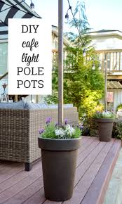 Things that you will need to create this colorful light is transparent glass jars, transparent glass paints, solar lights, and rope. Fox Hollow Cottage Diy Planter Pot Poles For Cafe String Lights