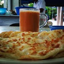 Roti canai is one of the many indian influenced malaysian foods that is widely available and very popular to eat throughout the entire country. Fairuzyusoff Pak Mael Roti Canai Pekan Junjong Breakfast