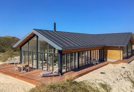 Bist Du Auf Der Suche Nach Einem Ferienhaus In Vejers Strand Buche Dieses Tolle Qualitatsferienhaus Bei Es Moderne Scheune Haus Haus Danemark Luxus Ferienhaus