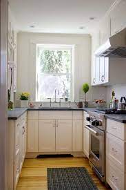 Exquisite cabinetry with radius ends gives this lovely white kitchen a retro, classic ambiance. Kitchen Ideas Kitchen Ideas Photo Gallery