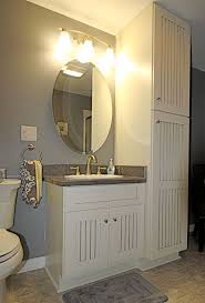 In this bathroom, elegant walnut cabinets. Bathroom Vanity Storage Syracuse Cny
