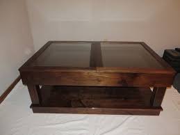 This coffee table has a swiveling top that functions as a shelf, and two sliding drawers for storage. Custom Sliding Top Walnut Coffee Table By The Oakman Custommade Com
