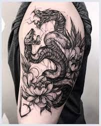 This tattoo may have a triangle pattern on the serpent's body with interchanging grey and black triangles. Tattoo Lifestyle Tattoo Spotlight