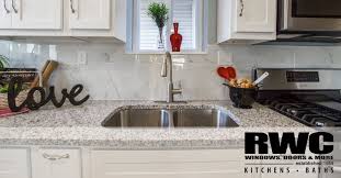 Trends in kitchen preferences and home design led to major appliances that were larger, smaller kitchens along with a smaller amount of cupboards. Greige Copper Accents Two Toned Cabinets Trendy Kitchen Designs To Consider Rwc