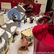 Pam mcgowan ladetto 8915 grove park drive. A Christmas Vacation Table Setting With Dept 56 Lit Houses Between Naps On The Porch