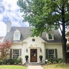 Creamy white painted brick house. I Keep Getting So Many Questions About What Color We Painted The Exterior Of This Hous House Paint Exterior Painted Brick House Exterior Paint Colors For House