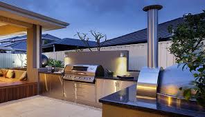Stainless steel cabinets are fixed above and. Modern Outdoor Entertaining Areas Google Search Luxury Outdoor Kitchen Outdoor Kitchen Design Modern Outdoor Kitchen
