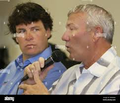 Michael Waltrip, left, looks